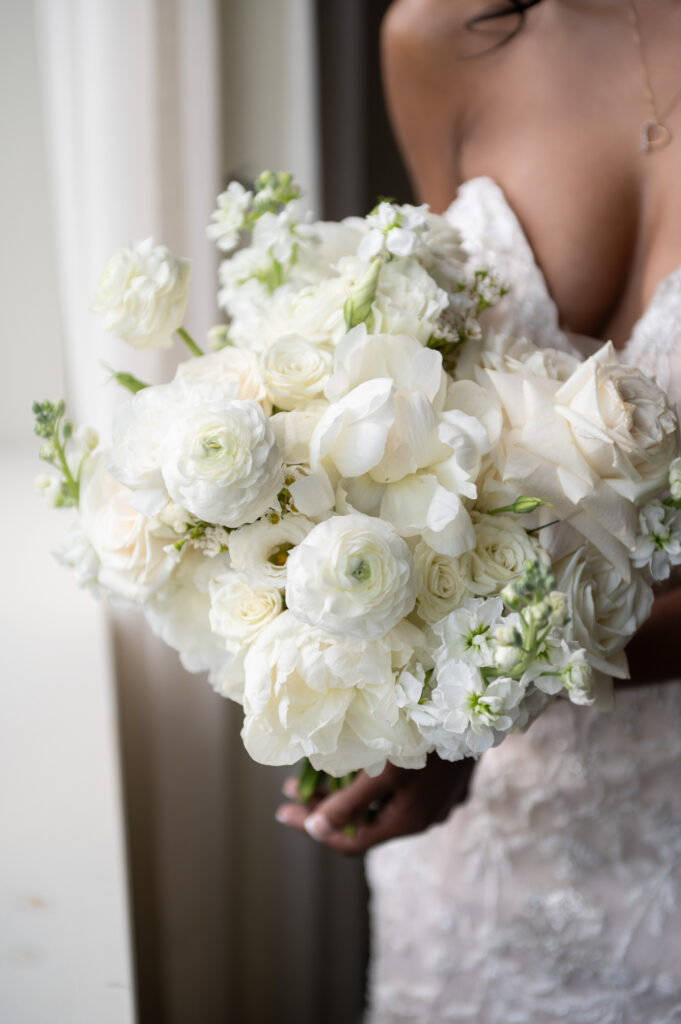Bride holding a white bouquet